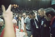 USA coach Hank Iba upset during dispute after officials gave USSR three tries to win Gold Medal Game at Rudi-Sedlmayer-Halle. Soviet Union won on controversial calls.